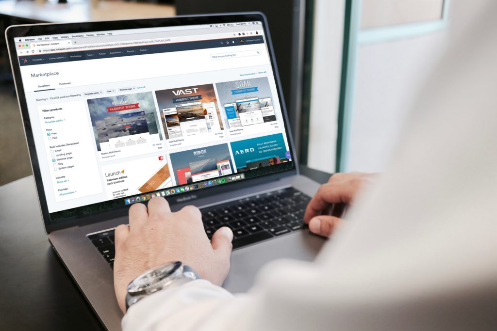 A Man Typing on the Laptop