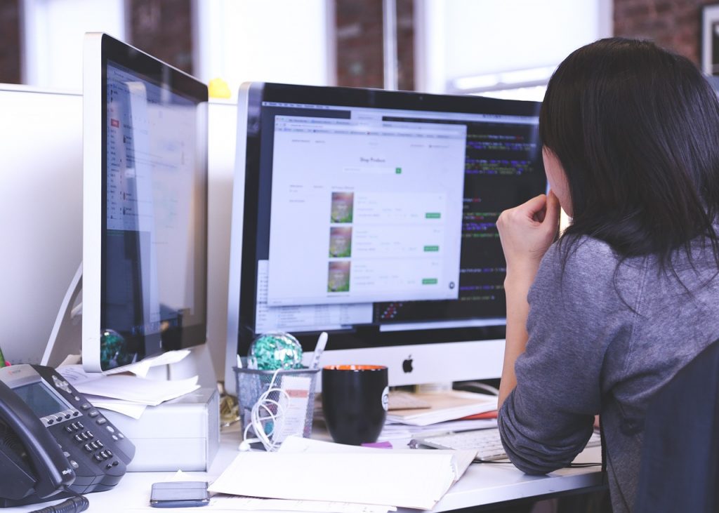 A Woman Thinking in Front of the Laptop