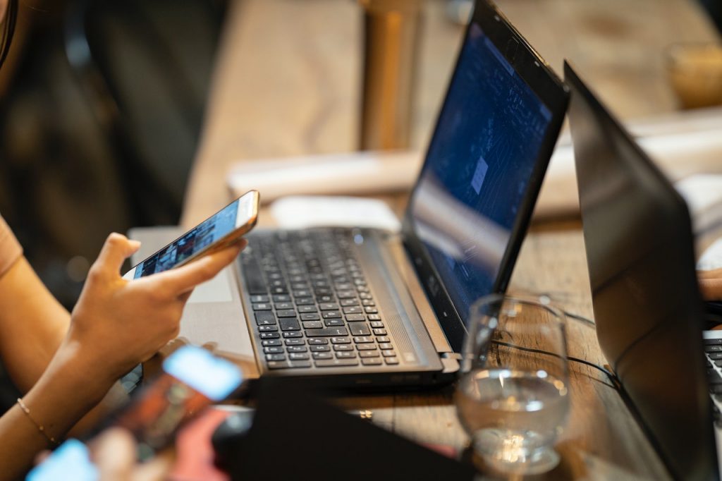 A Woman Typing on the Phone