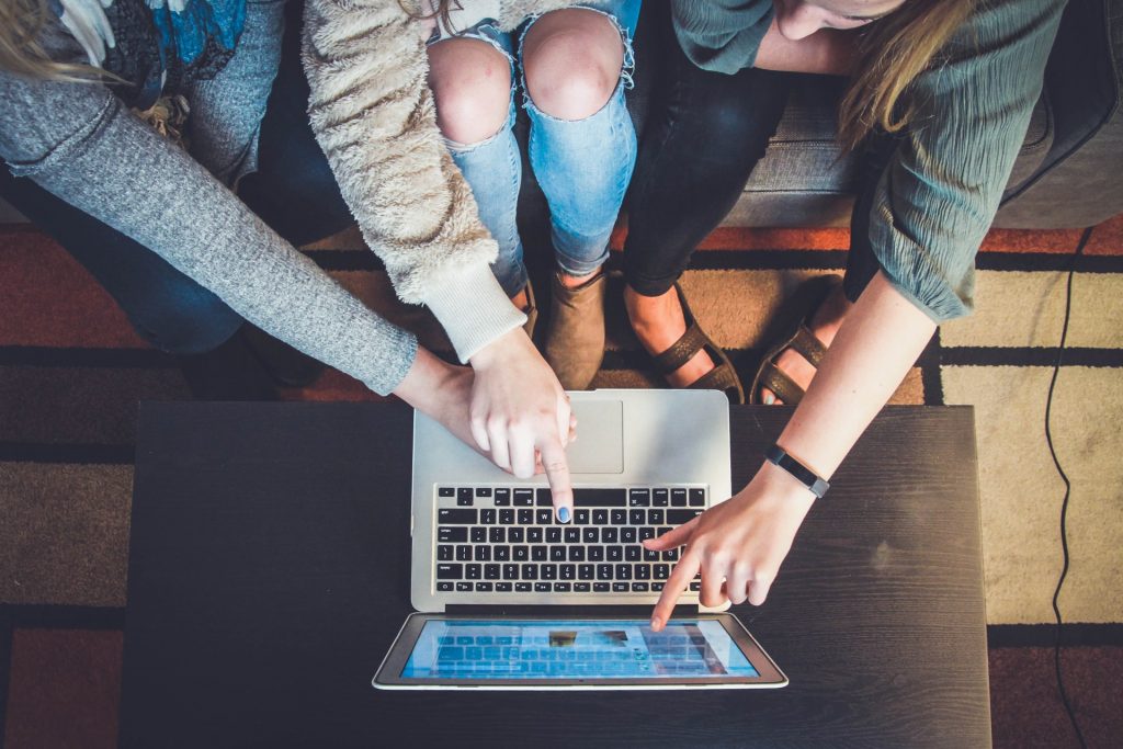 Women Pointing at the Laptop