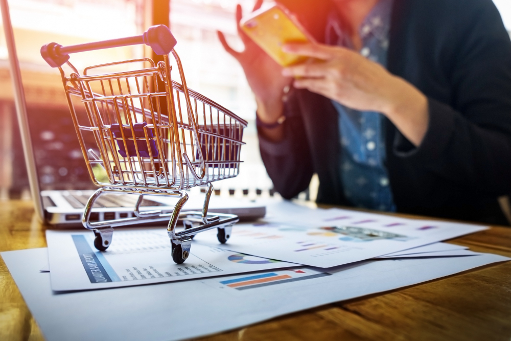 A Woman Inputting Card Information and Key on Phone or Laptop While Shopping Online