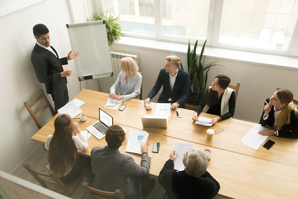 A Man CEO Giving Presentation at Corporate Team Meeting Concept 