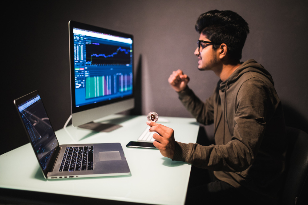 Indian Trader With Bitcoin Checking Stock Trading Data
