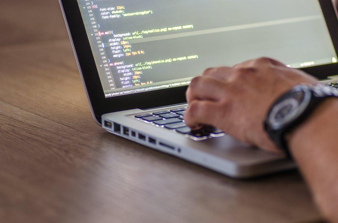 Laptop With Code on the Screen 