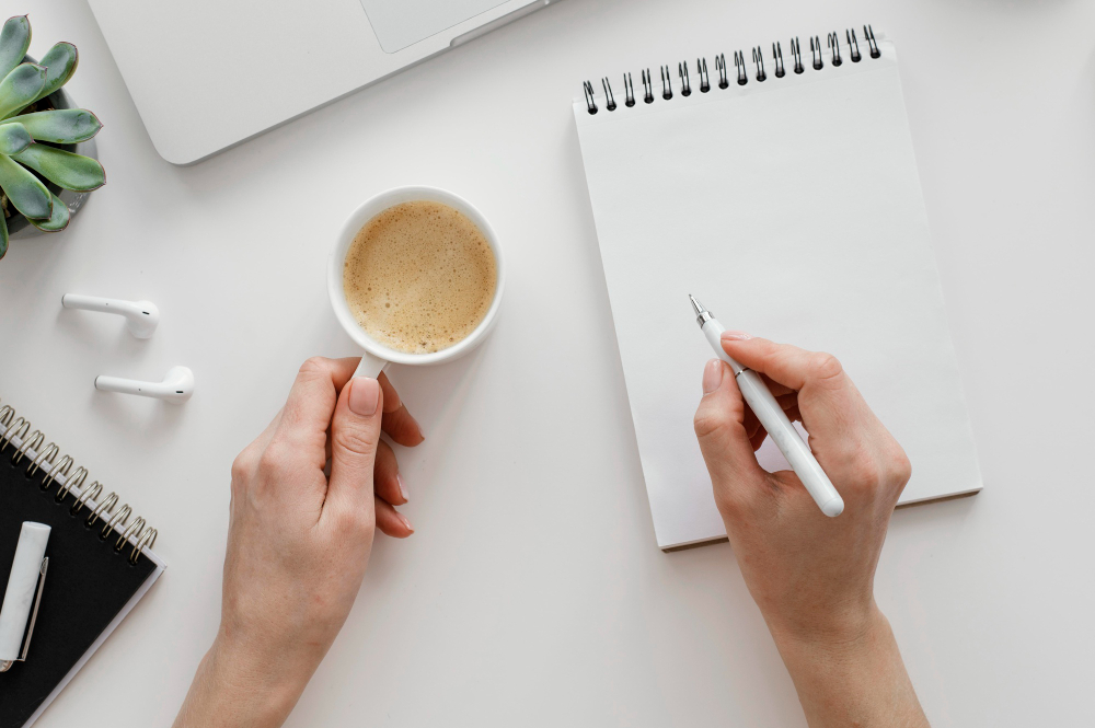 woman taking notes on a notepad