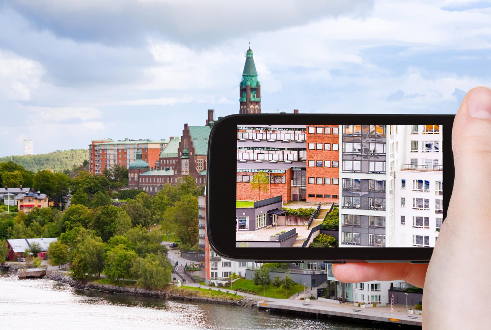 Tourist Taking Photo of Houses in Stockholm